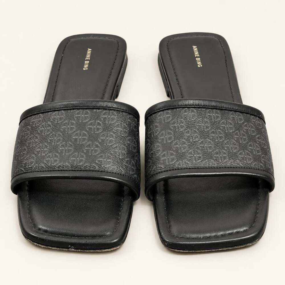 Anine Bing Black Ria Slides in Black Monogram Print